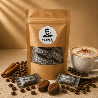 قرص قهوه کافی کندی کاپوچینو اصل کنار فنجان کاپوچینو با فوم شیر